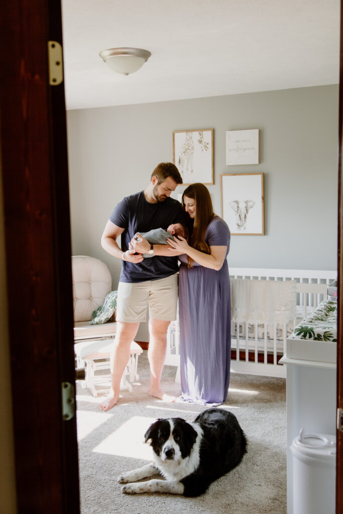 Mother and Father cuddling her newborn during a lifestyle photography session.