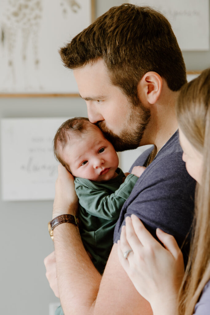 Family cuddling together during an in-home family photography session in Grand Rapids.