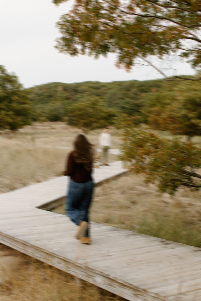 Man leading his girlfriend through Rosy Mound Natural Area before proposing.